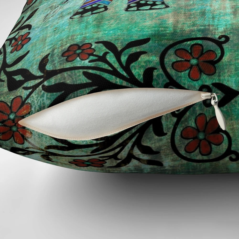 Decorative throw pillow featuring a vibrant elephant design with intricate Indian and Asian-inspired floral patterns in shades of blue and teal.