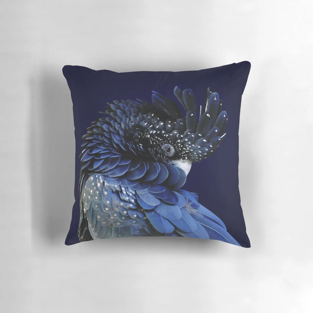 Decorative pillow featuring a profile portrait of a red-tailed black cockatoo with a fibonacci-inspired design