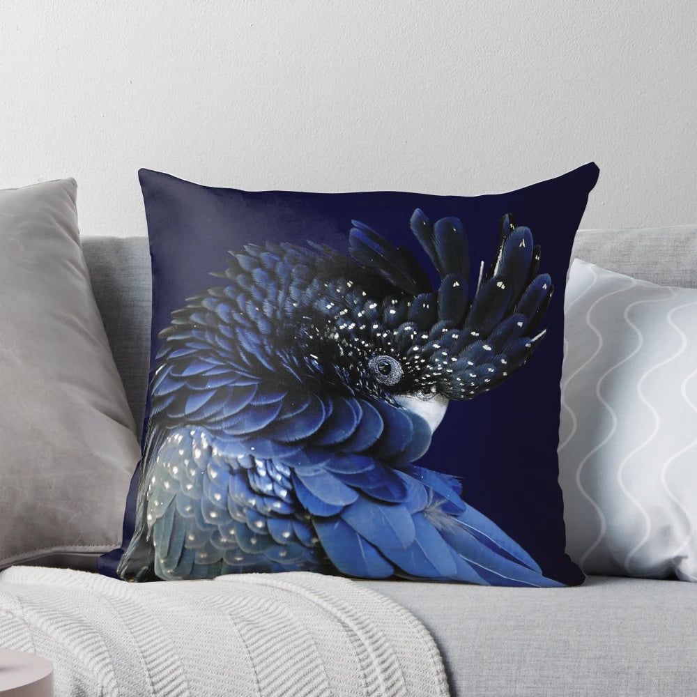 Decorative pillow featuring a profile portrait of a red-tailed black cockatoo with a fibonacci-inspired design