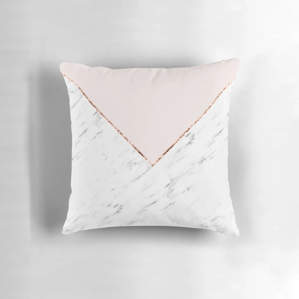 Decorative geometric marble pillow in blush pink and rose gold hues