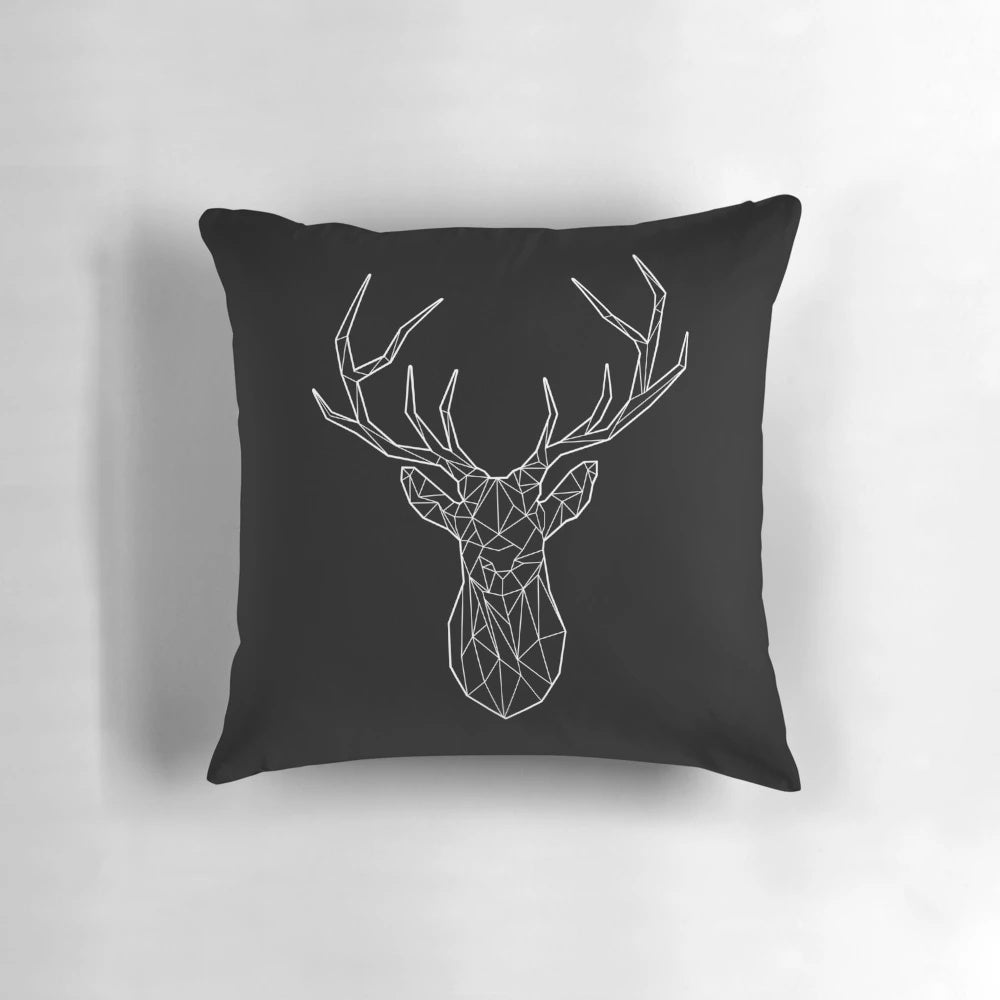 Geometric black and white stag or deer head silhouette design on a square pillow