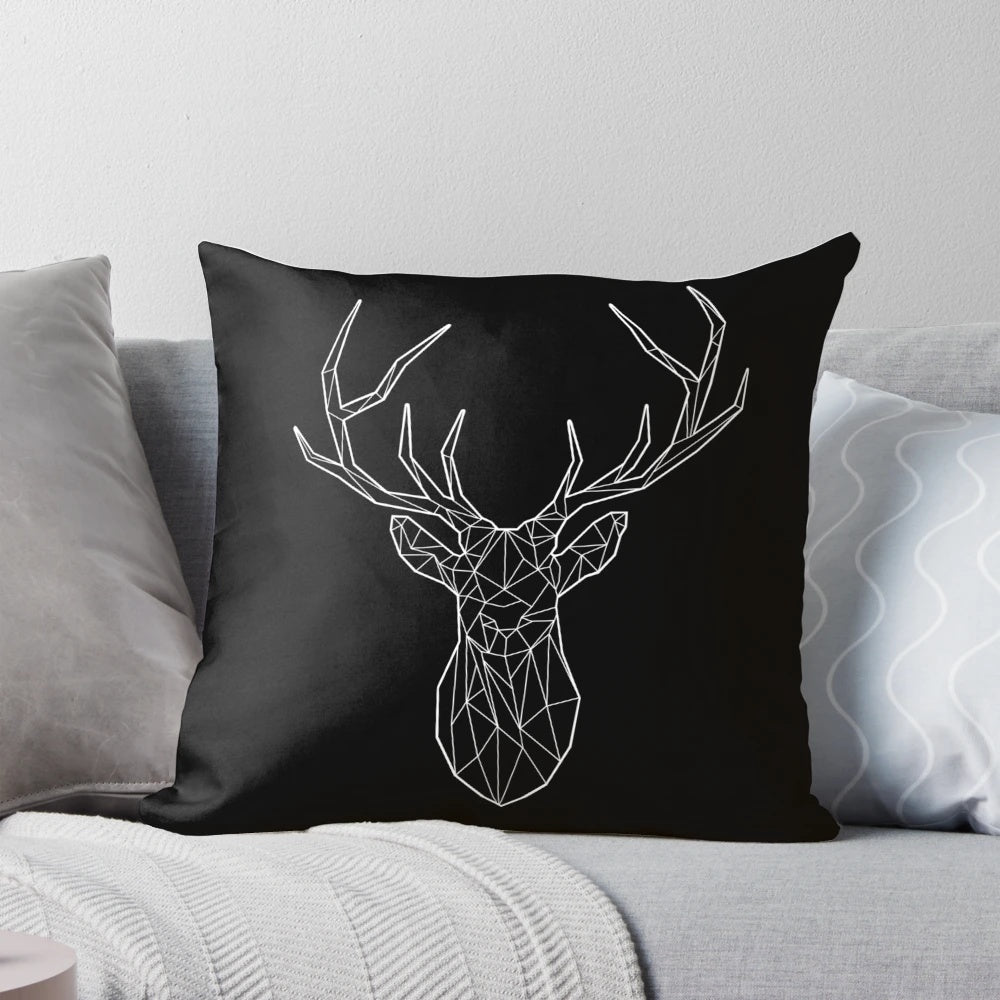 Geometric black and white stag or deer head silhouette design on a square pillow