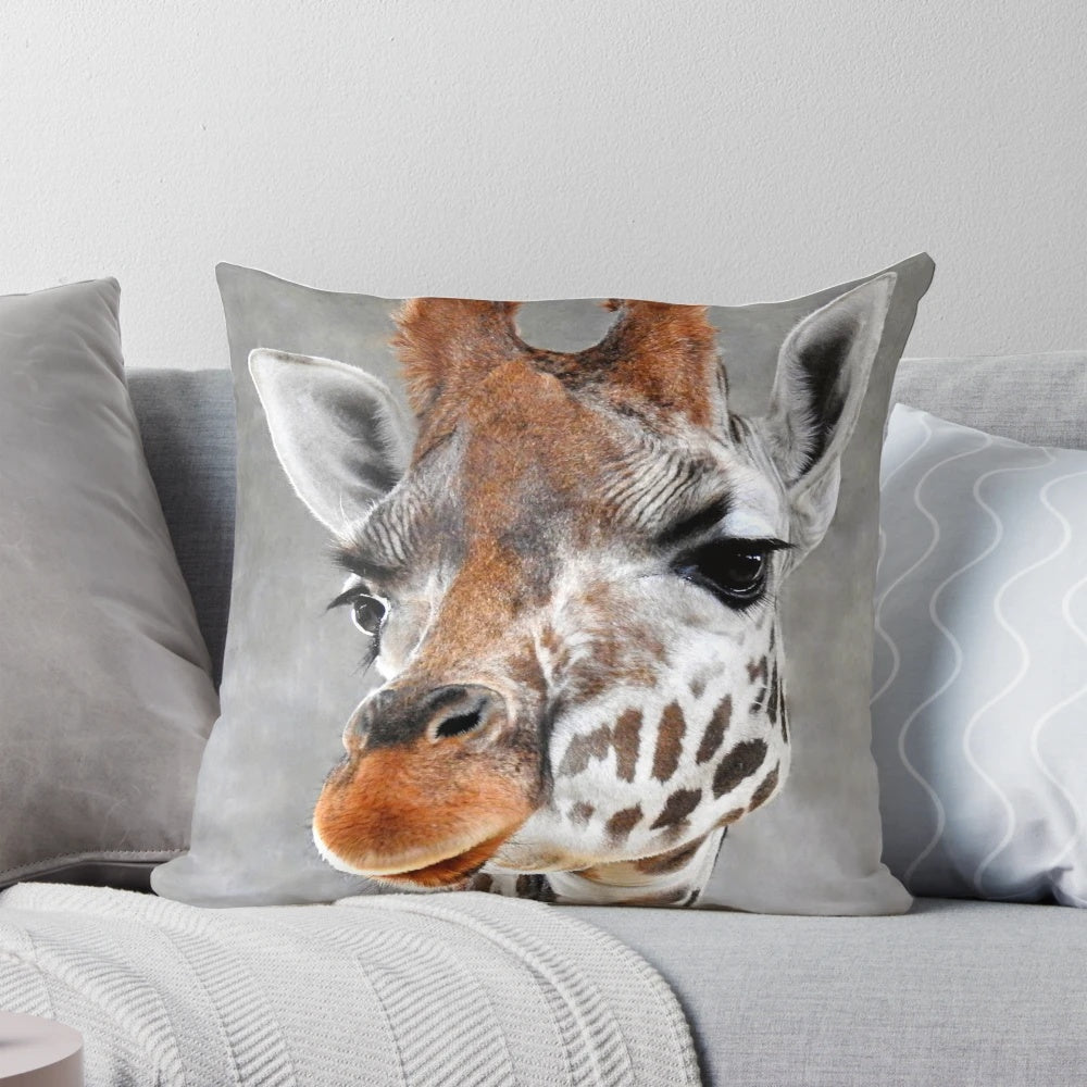 A soft, grey pillow with a charming giraffe design, perfect for adding a touch of nature to your home.