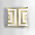 Decorative gold and white striped pillow with a bold, modern design