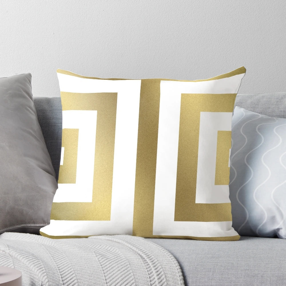Decorative gold and white striped pillow with a bold, modern design