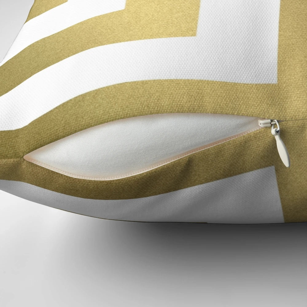 Decorative gold and white striped pillow with a bold, modern design