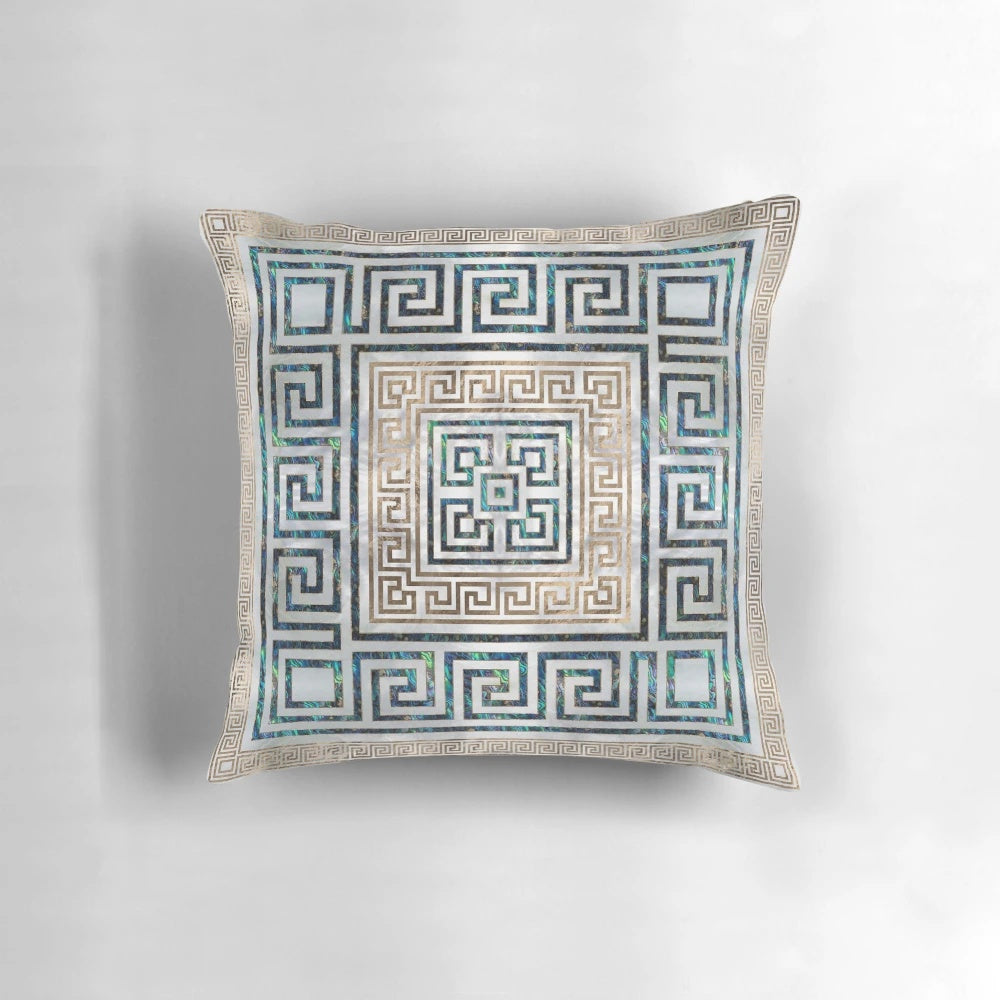 Decorative throw pillow featuring a Greek-inspired meander key pattern in abalone and gold.