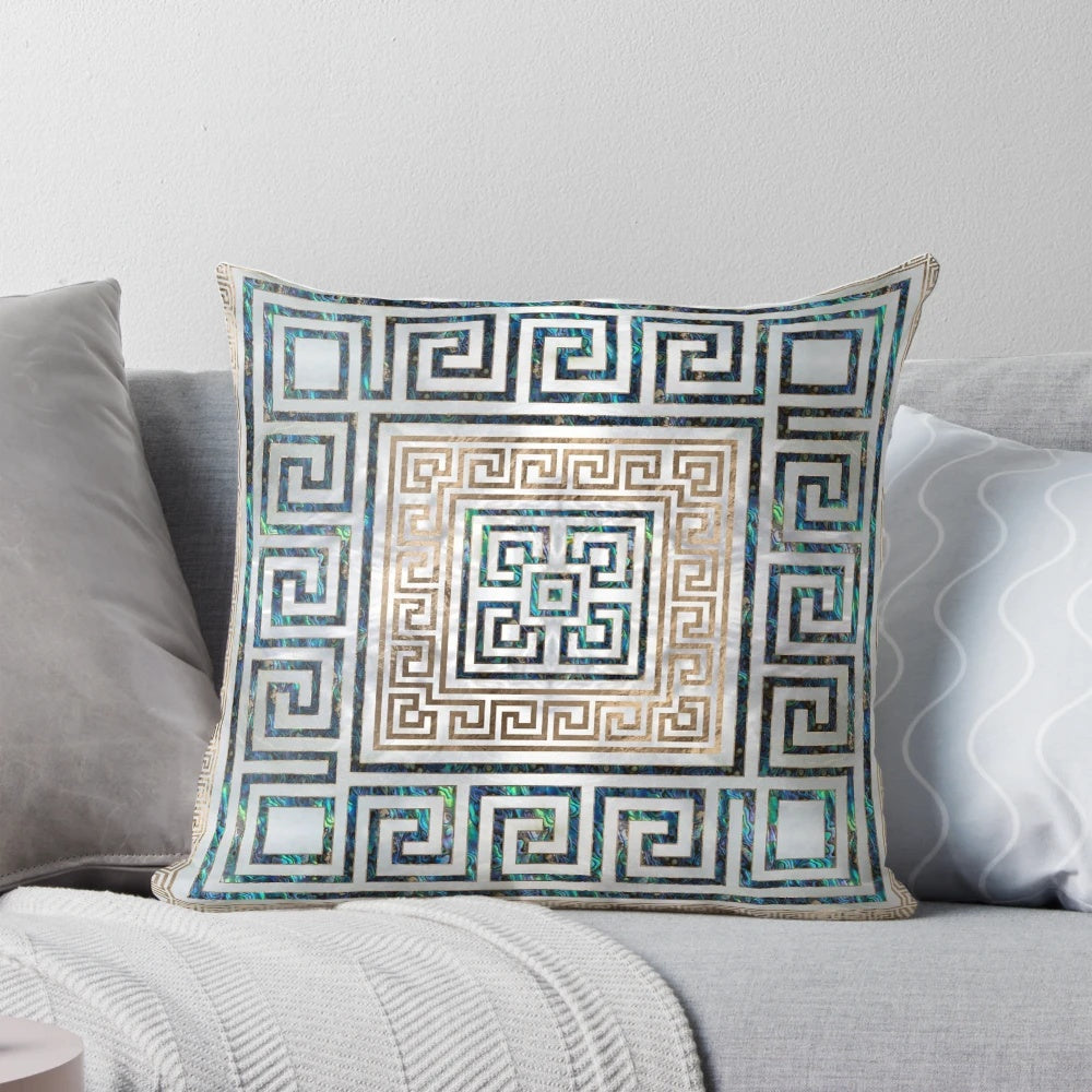Decorative throw pillow featuring a Greek-inspired meander key pattern in abalone and gold.