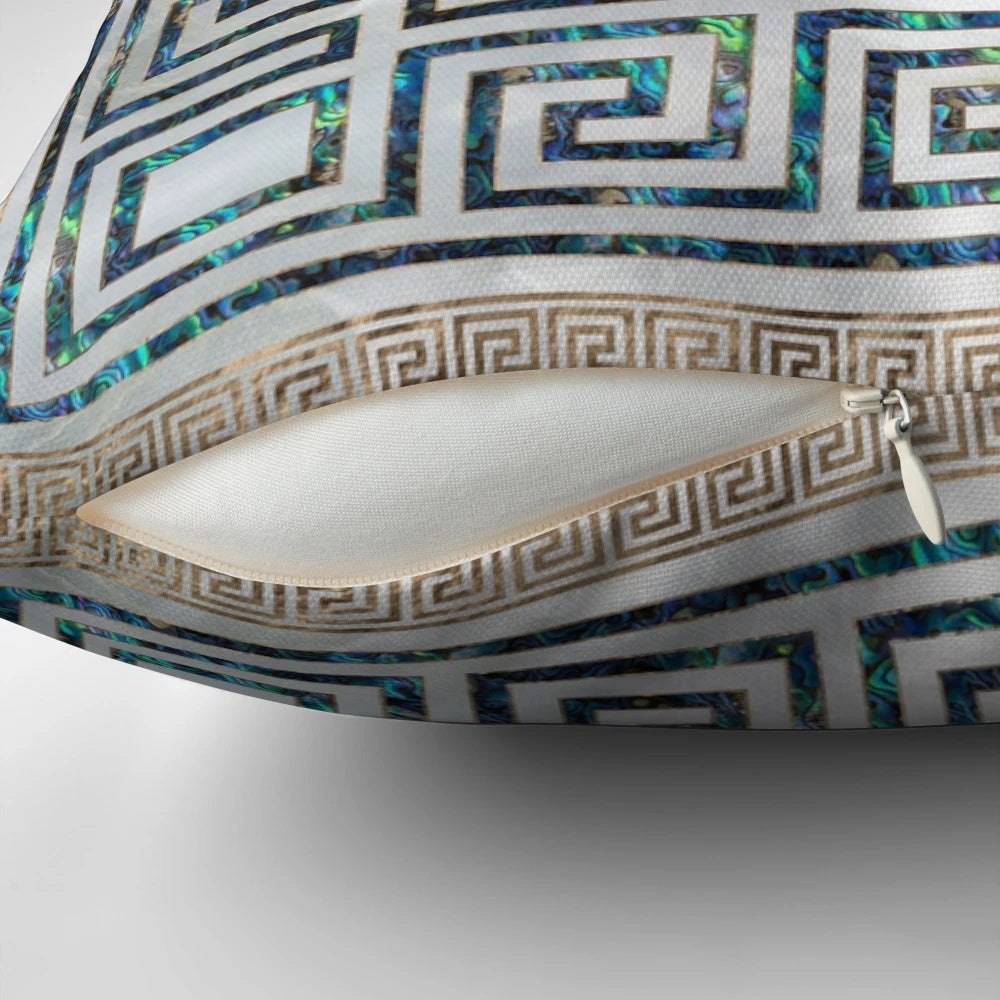 Decorative throw pillow featuring a Greek-inspired meander key pattern in abalone and gold.