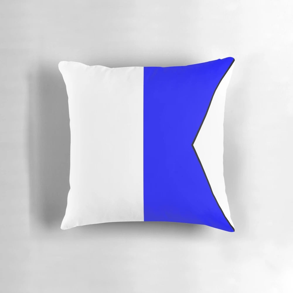 Colorful international maritime signal flag pillow featuring a collection of nautical alphabet symbols.