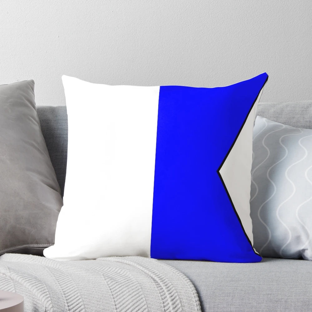 Colorful international maritime signal flag pillow featuring a collection of nautical alphabet symbols.