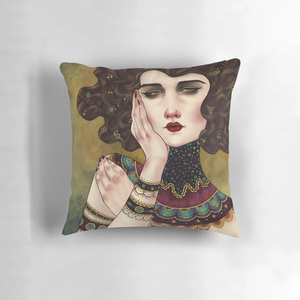 A decorative throw pillow featuring the iconic Klimt muses painting with vibrant colors and patterns.