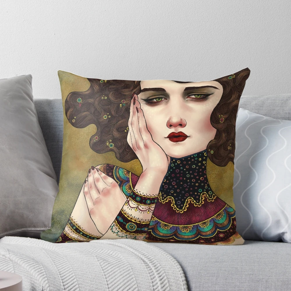 A decorative throw pillow featuring the iconic Klimt muses painting with vibrant colors and patterns.