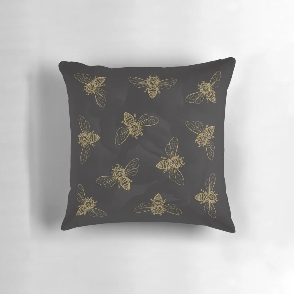 Vibrant throw pillow featuring a detailed mandala design with bees, in shades of yellow, black, and gold.