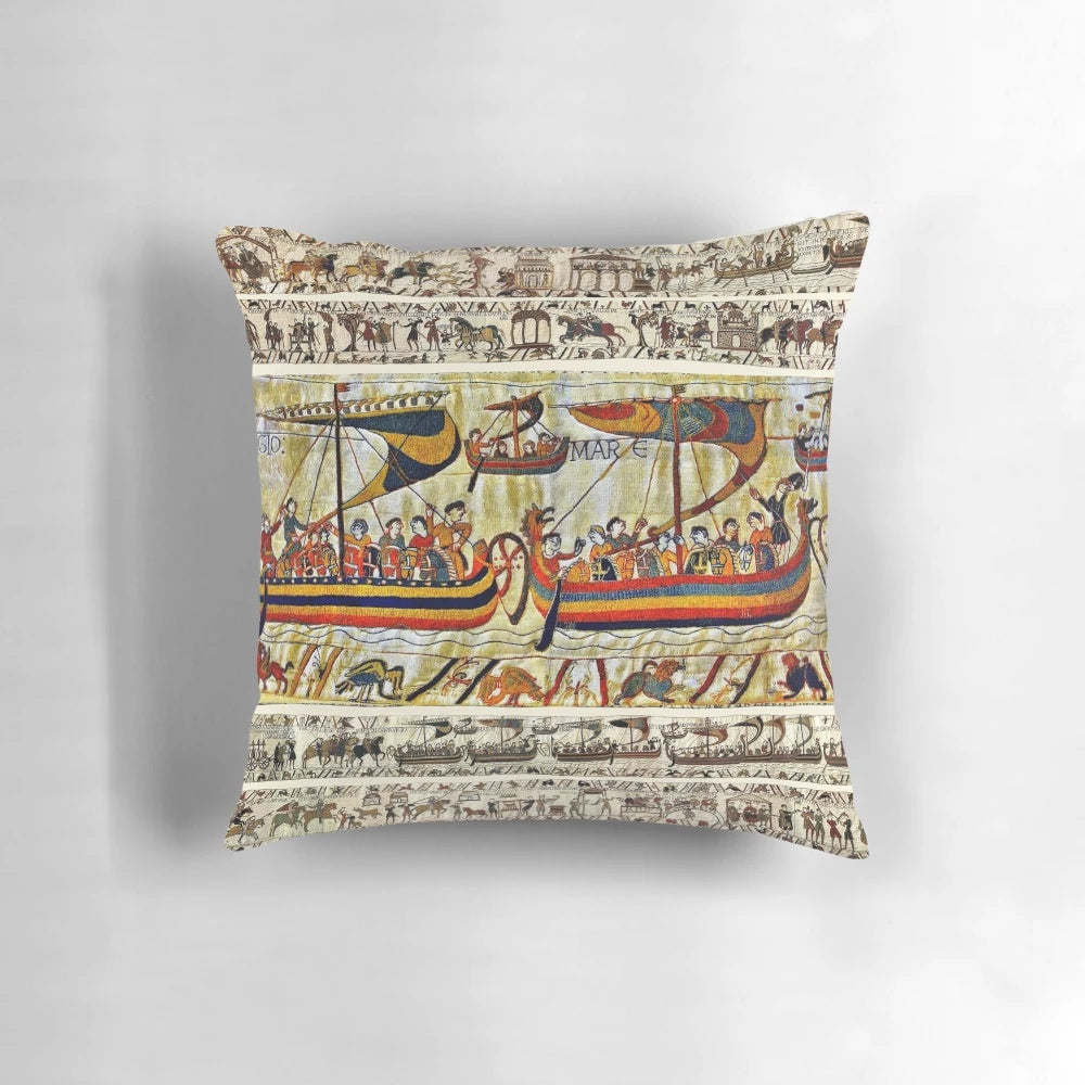 "Decorative medieval-style pillow featuring the iconic Bayeux Tapestry design with Viking ships and scenes from the Norman conquest of England"