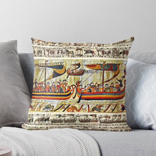 "Decorative medieval-style pillow featuring the iconic Bayeux Tapestry design with Viking ships and scenes from the Norman conquest of England"