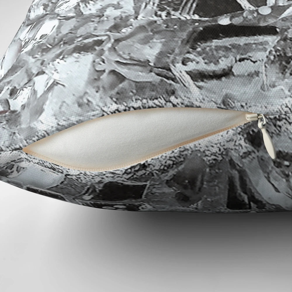Artistic photographic image of mirrored and glass elements on a decorative accent pillow.