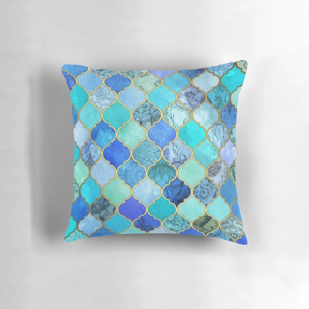 Decorative Moroccan tile pattern pillow in cobalt blue, aqua, and gold colors