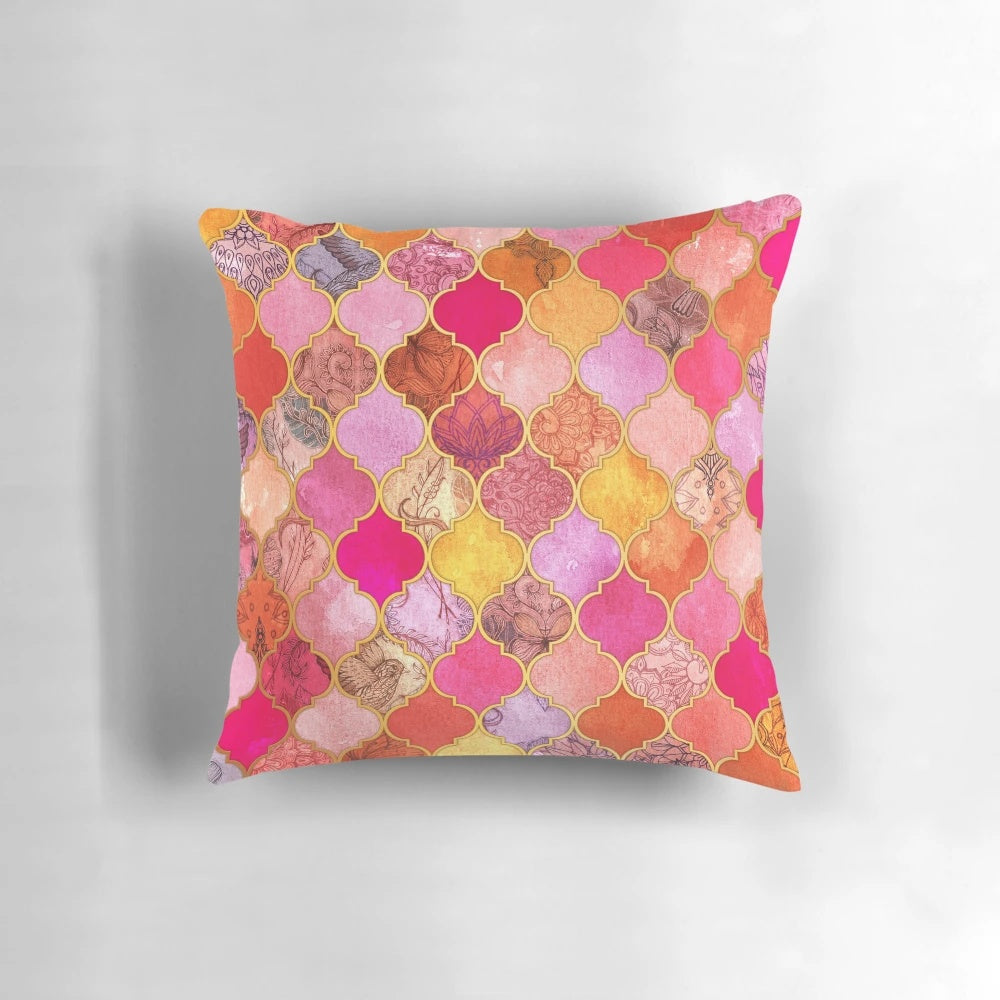 Decorative Moroccan tile pattern pillow in vibrant colors of hot pink, gold, tangerine, and taupe