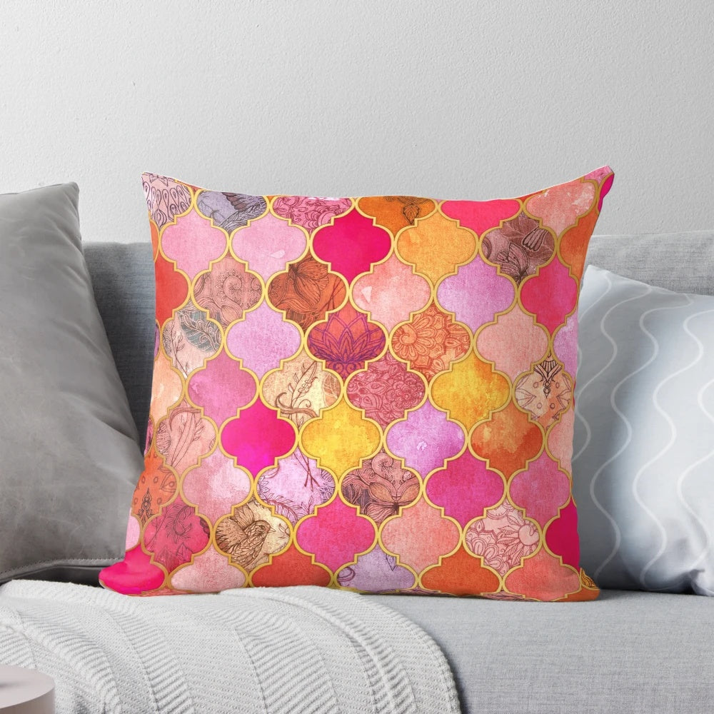 Decorative Moroccan tile pattern pillow in vibrant colors of hot pink, gold, tangerine, and taupe