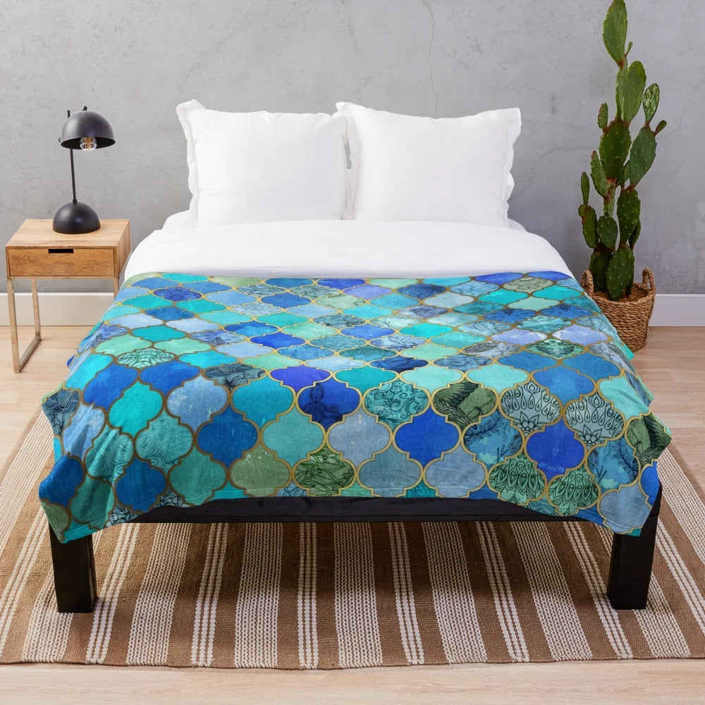 Decorative Moroccan tile pattern plush blanket in cobalt blue, aqua, and gold