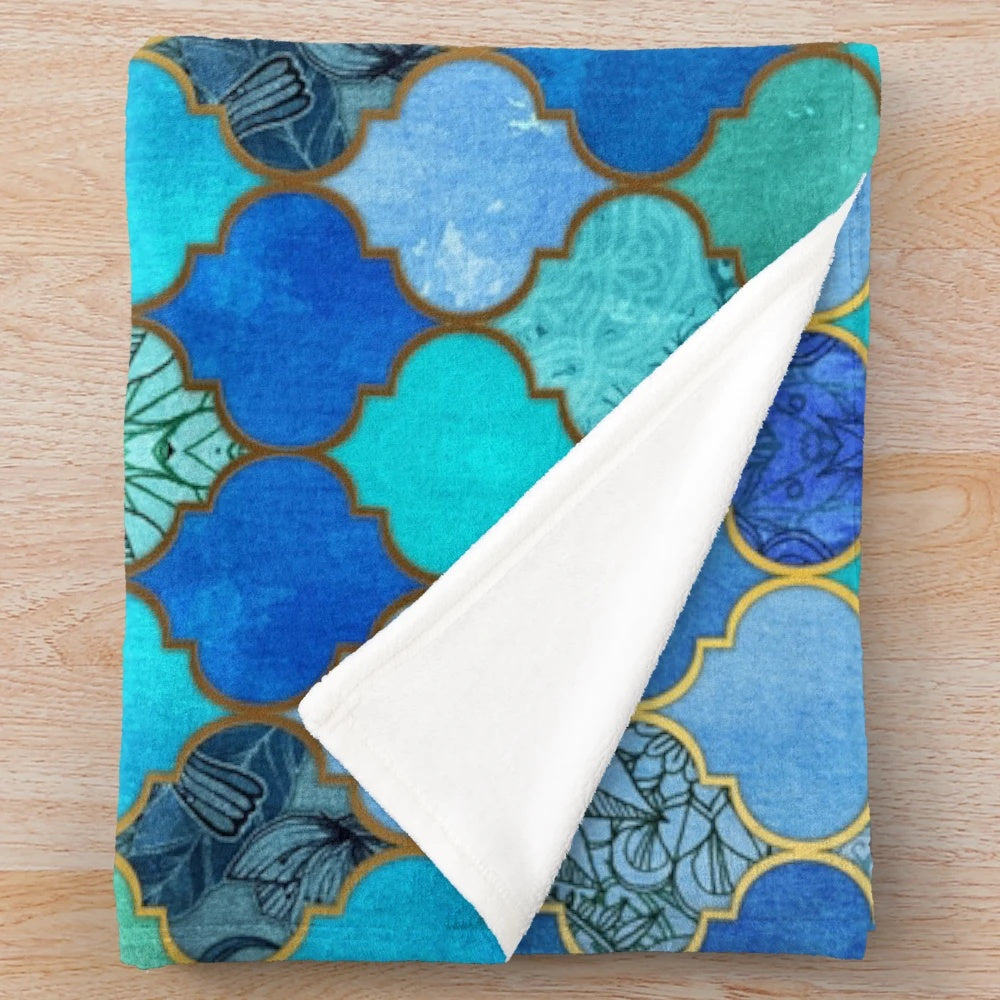 Decorative Moroccan tile pattern plush blanket in cobalt blue, aqua, and gold