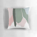 Decorative pillow with abstract art brush strokes in soft blush pink and sage green colors