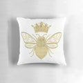 A gold and white embroidered pillow with a beautiful queen bee design, perfect for adding a touch of nature-inspired style to your home.