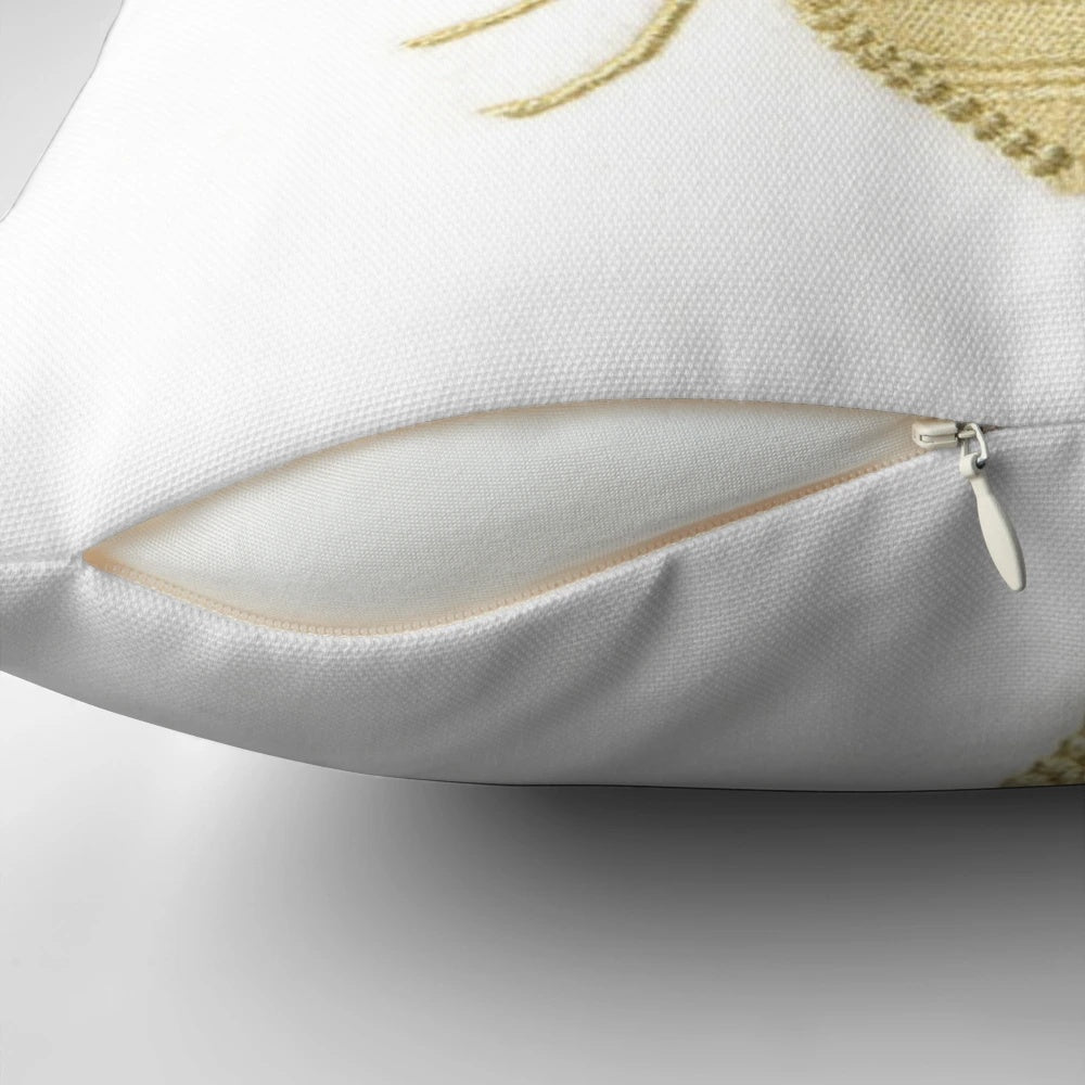 A gold and white embroidered pillow with a beautiful queen bee design, perfect for adding a touch of nature-inspired style to your home.