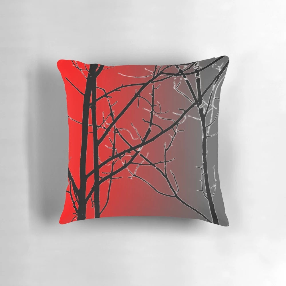 A vibrant red and gray decorative pillow with a nature-inspired design.