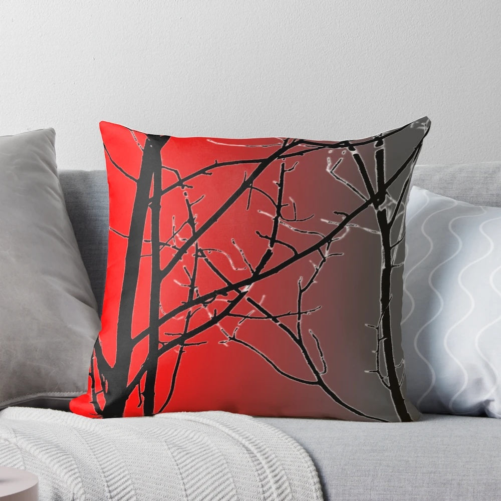 A vibrant red and gray decorative pillow with a nature-inspired design.