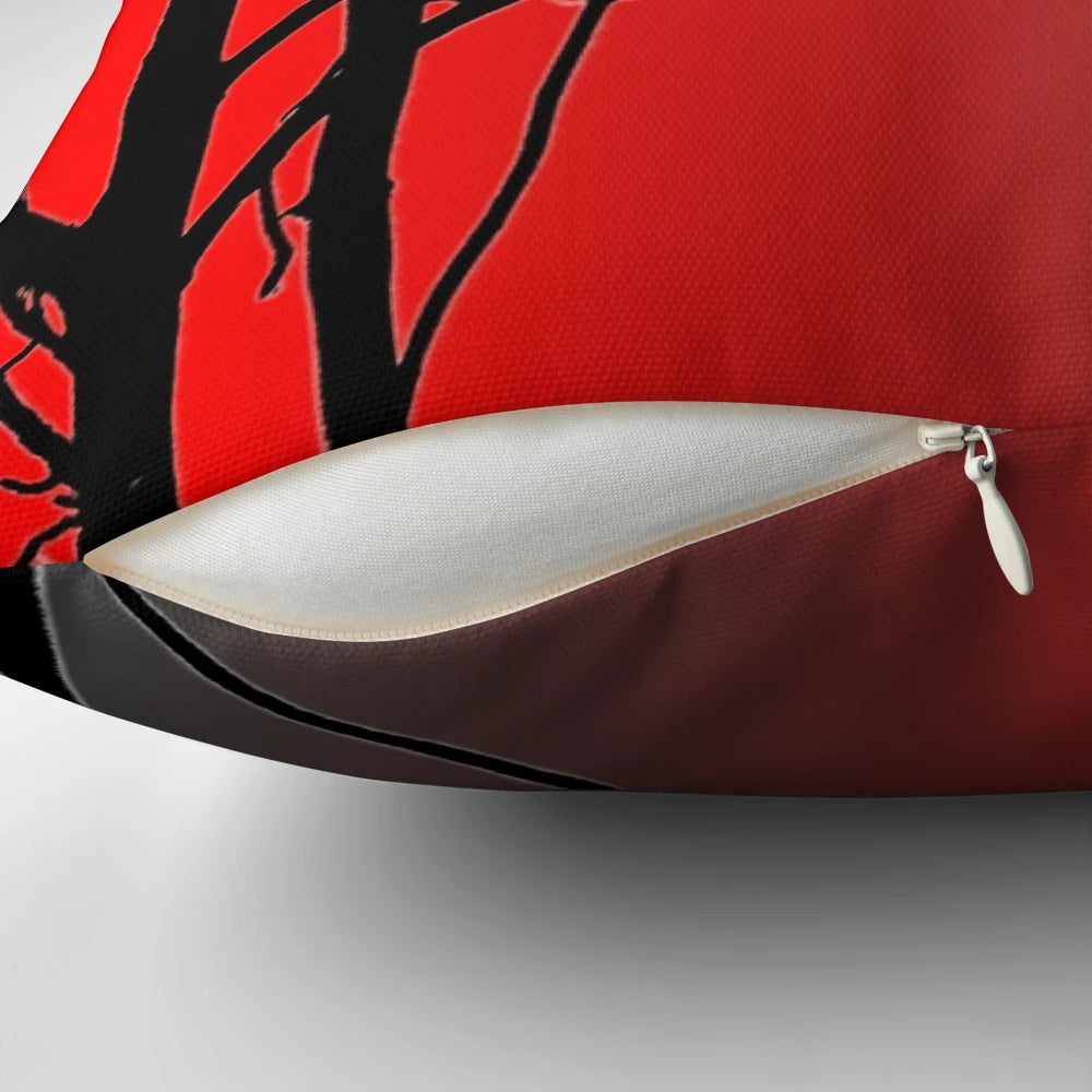 A vibrant red and gray decorative pillow with a nature-inspired design.