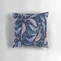 A decorative pillow featuring a school of whales in an abstract, underwater scene with a seamless pattern.