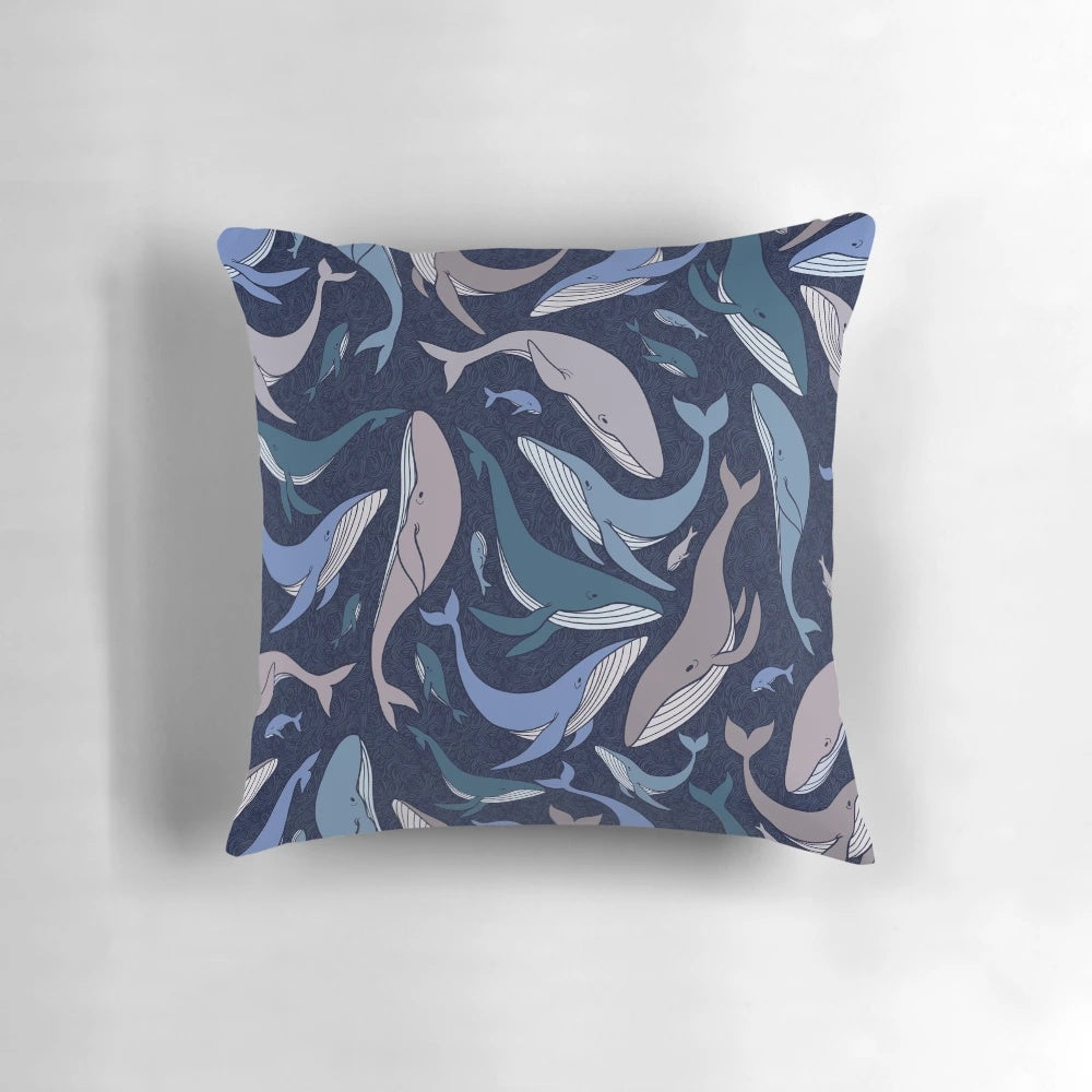 A decorative pillow featuring a school of whales in an abstract, underwater scene with a seamless pattern.