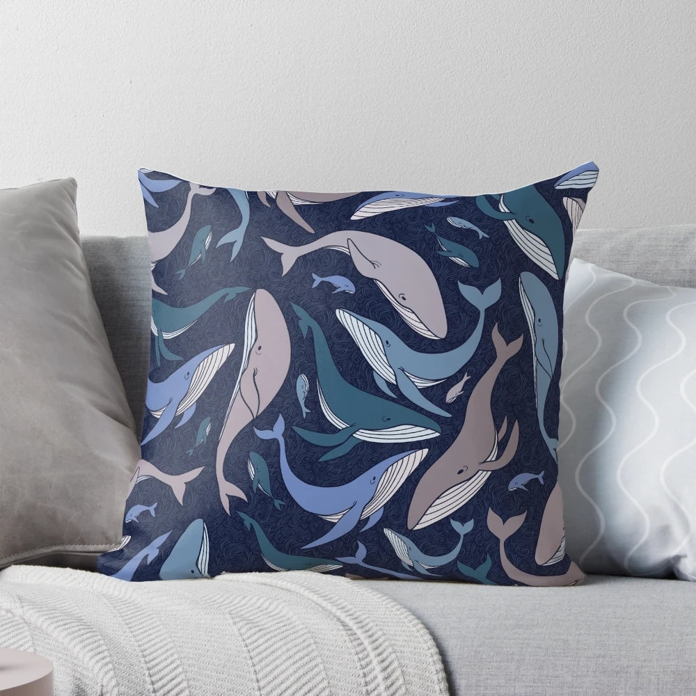 A decorative pillow featuring a school of whales in an abstract, underwater scene with a seamless pattern.