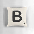 Stylish throw pillow featuring a decorative scrabble tile design