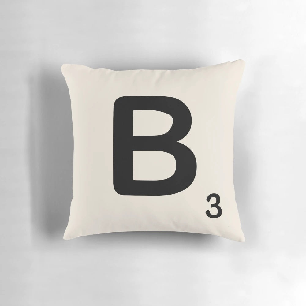 Stylish throw pillow featuring a decorative scrabble tile design