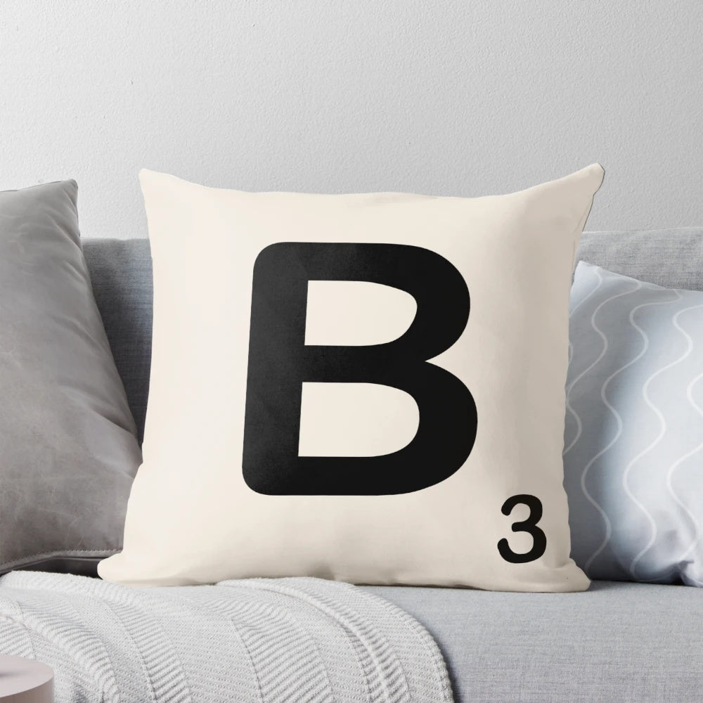 Stylish throw pillow featuring a decorative scrabble tile design