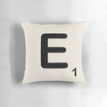 Scrabble tile inspired decorative throw pillow with letter E design, perfect for adding a fun, typographic touch to your home.