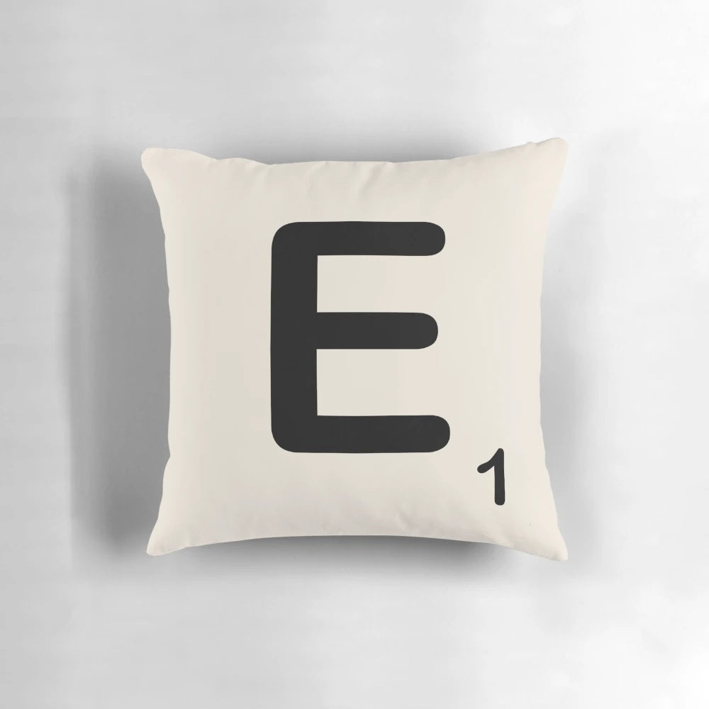 Scrabble tile inspired decorative throw pillow with letter E design, perfect for adding a fun, typographic touch to your home.