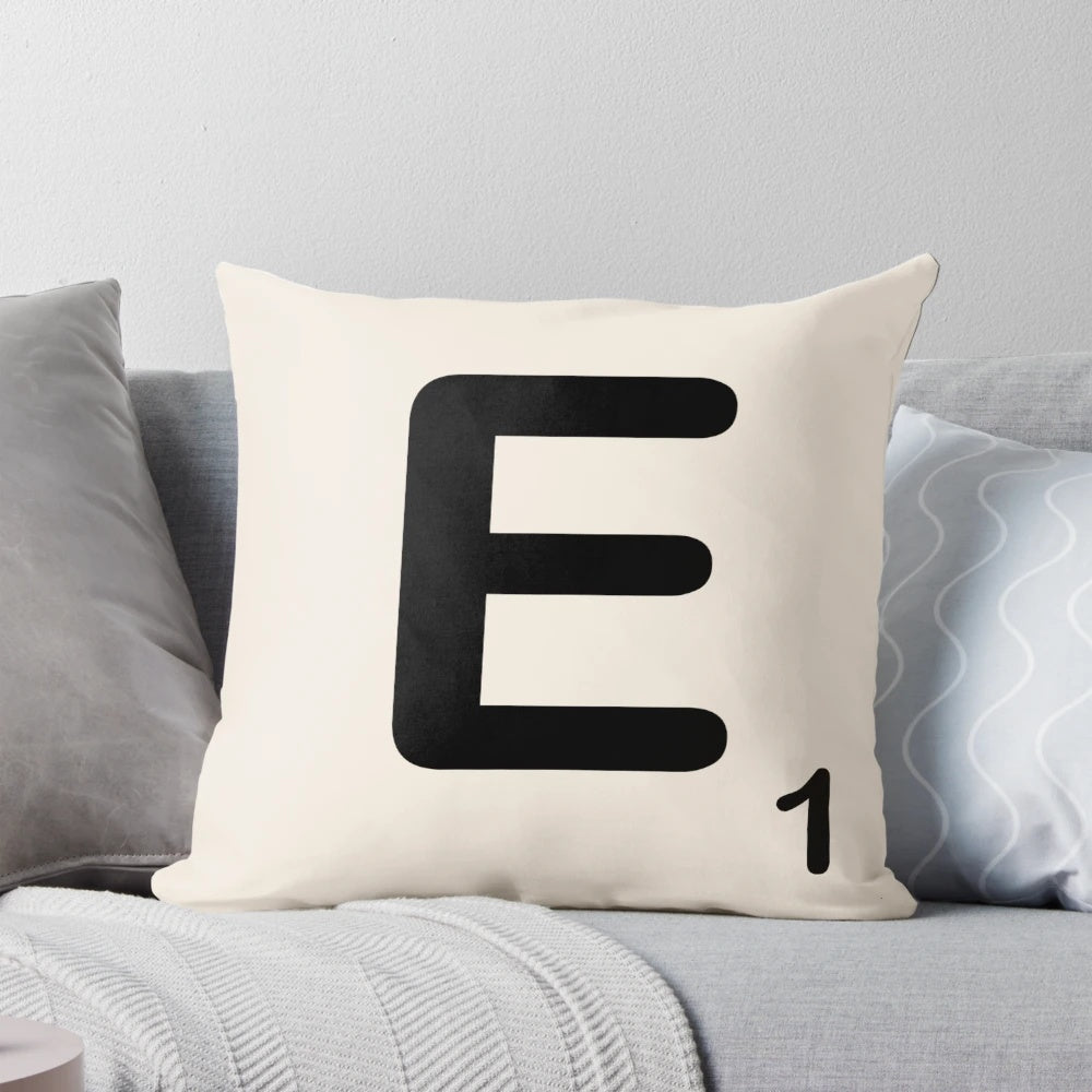 Scrabble tile inspired decorative throw pillow with letter E design, perfect for adding a fun, typographic touch to your home.