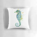 A green watercolor seahorse pillow with a coastal, nautical design