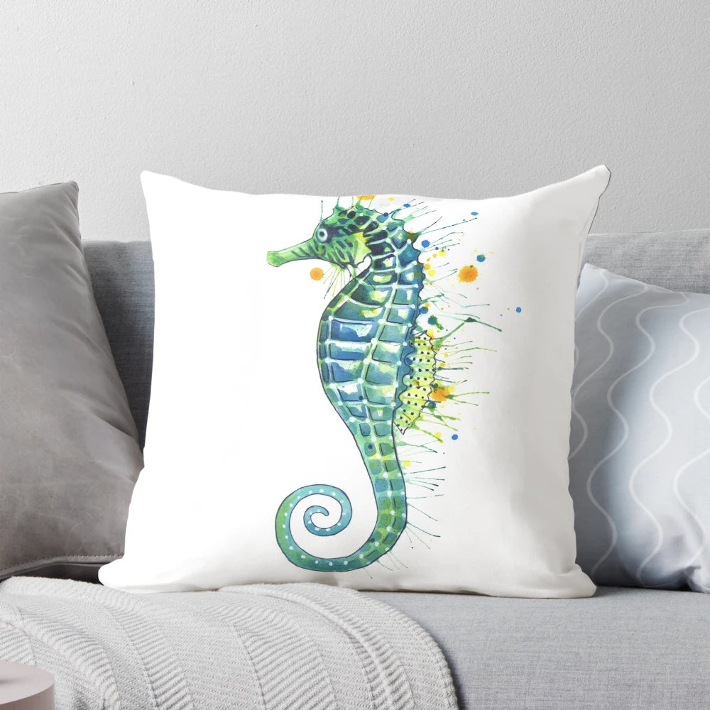 A green watercolor seahorse pillow with a coastal, nautical design