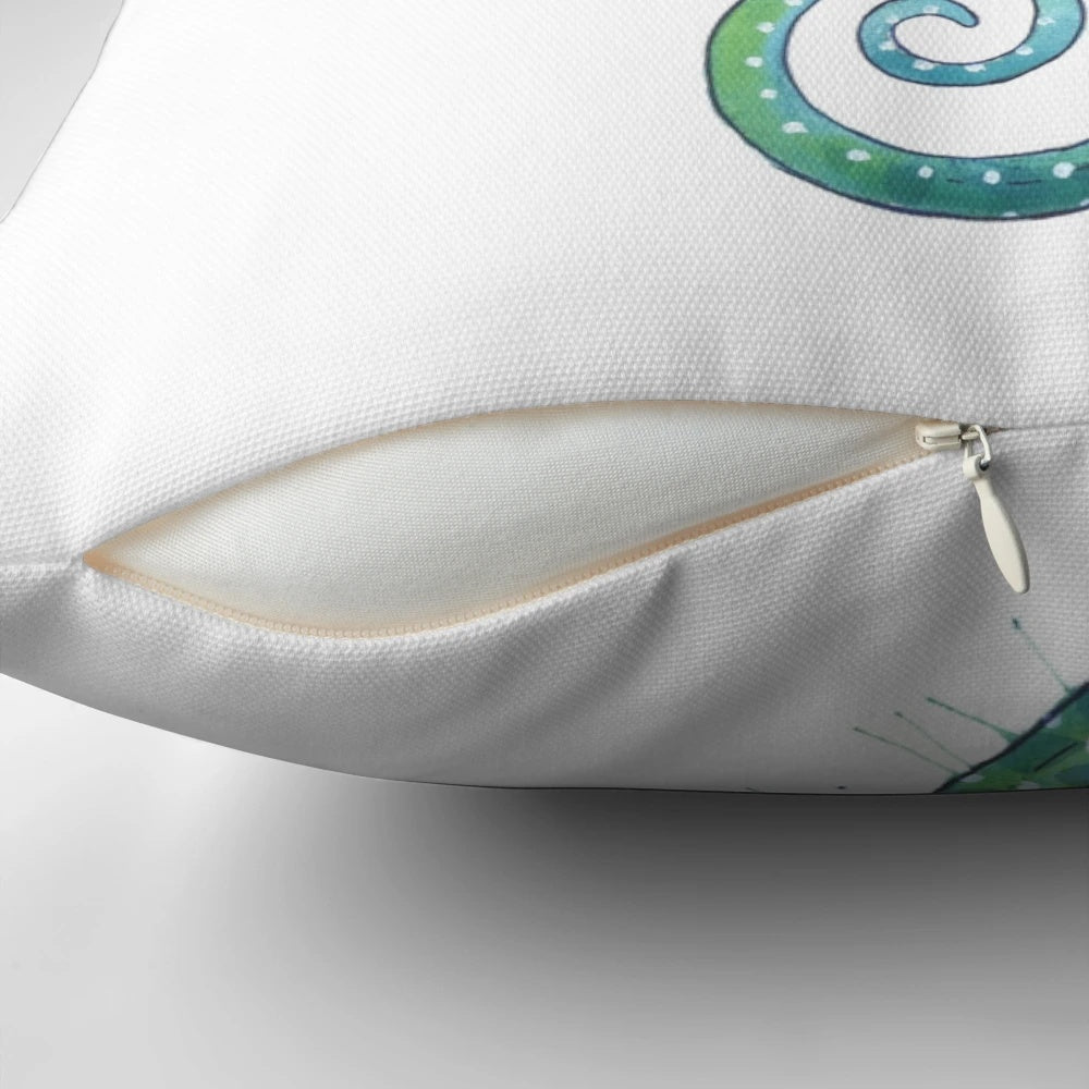 A green watercolor seahorse pillow with a coastal, nautical design
