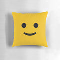 A cozy and cheerful decorative pillow with a happy smiley face design