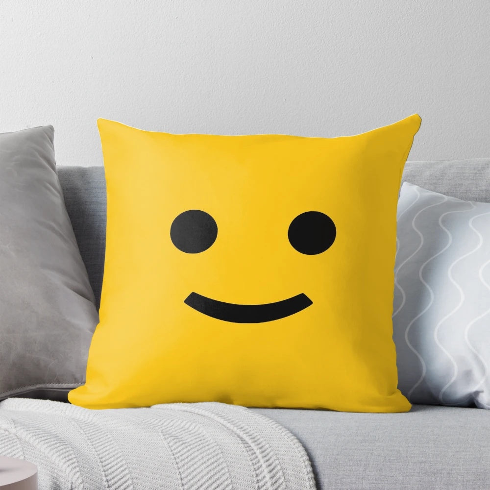 A cozy and cheerful decorative pillow with a happy smiley face design