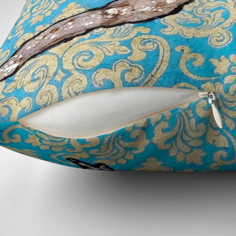A decorative throw pillow featuring a vibrant illustration of a yellow and black songbird, such as a goldfinch, surrounded by a floral and metallic design.