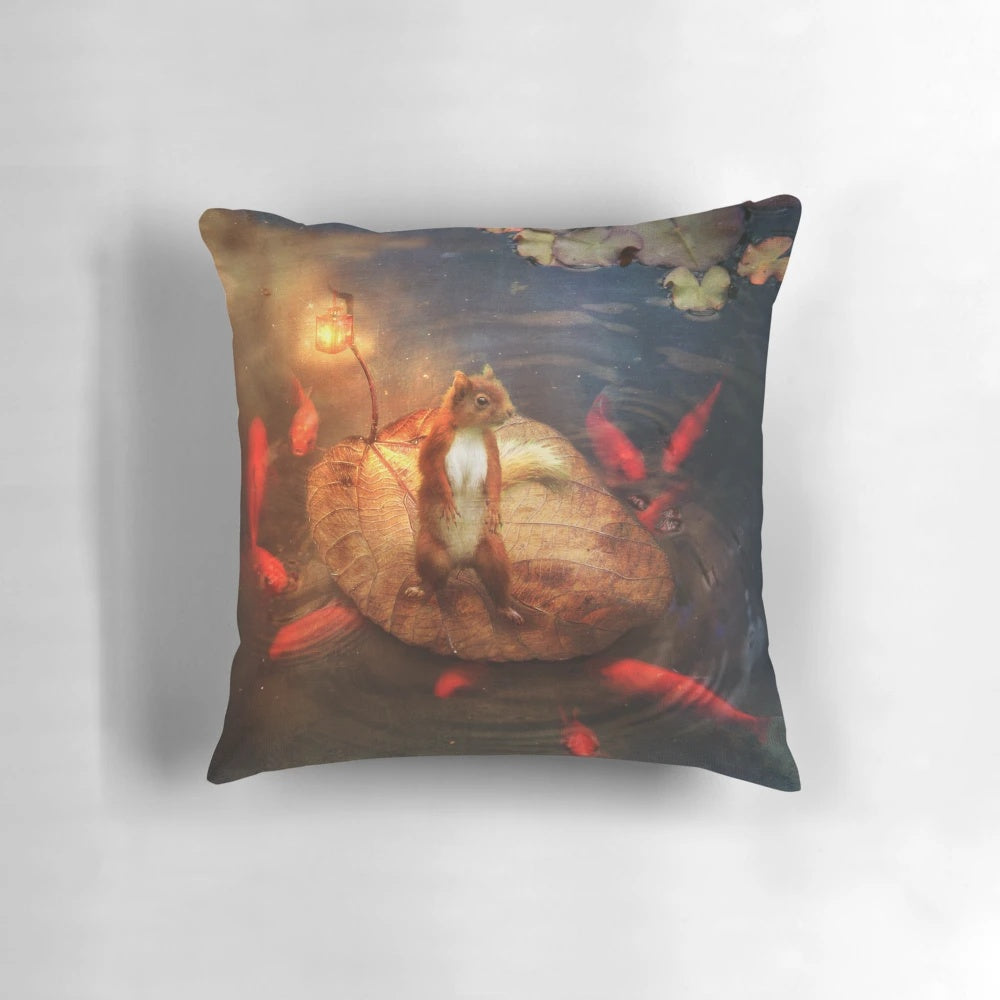 A plush, squirrel-shaped decorative pillow with nature-themed elements like water, boats, and plants.