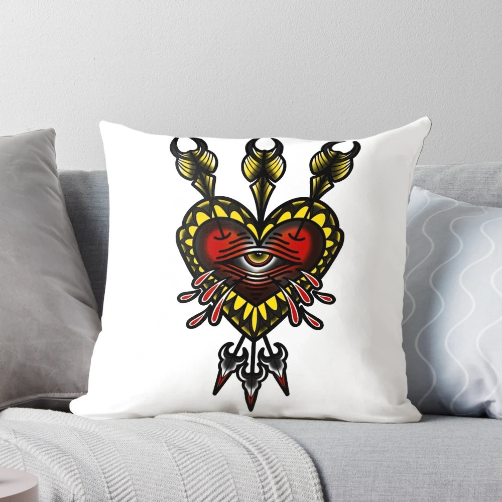 Graphic tattoo-inspired heart and arrow design printed on a soft, decorative pillow.