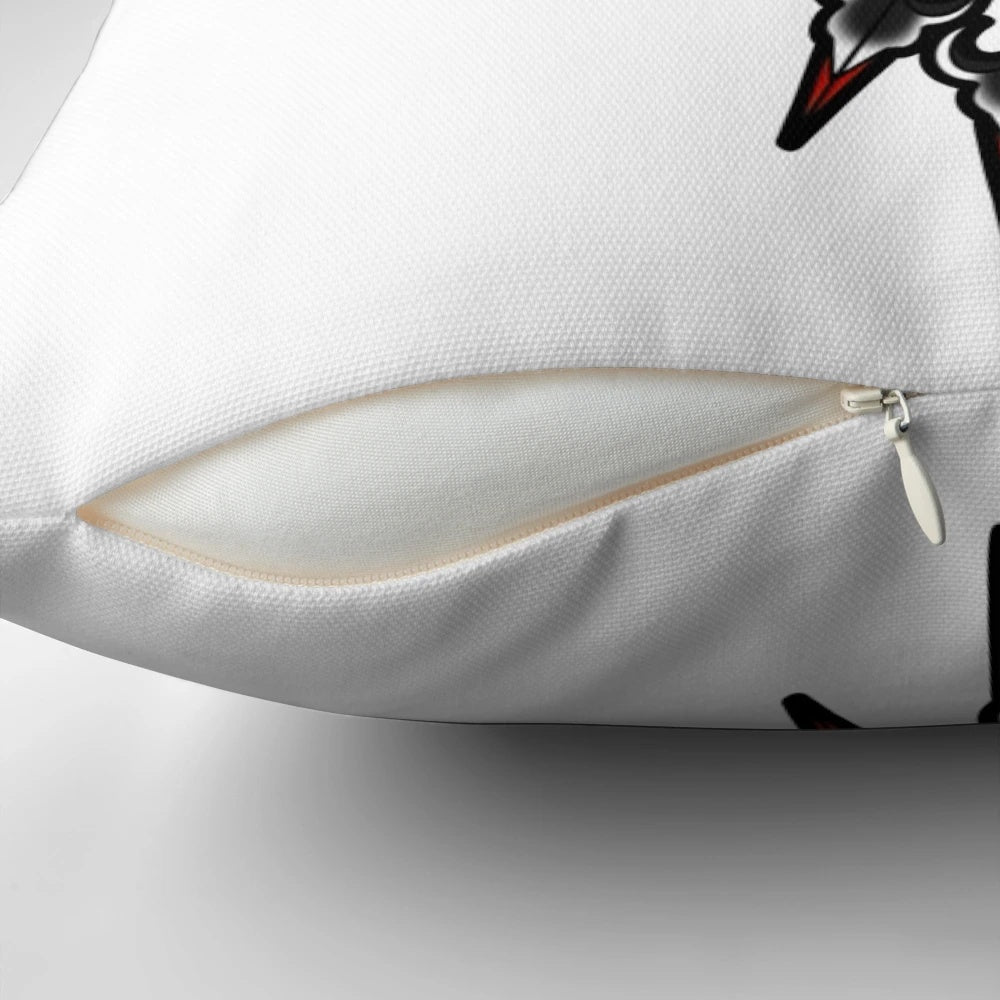 Graphic tattoo-inspired heart and arrow design printed on a soft, decorative pillow.